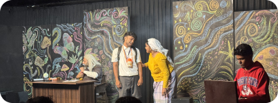 Live theatrical performance on a painted stage